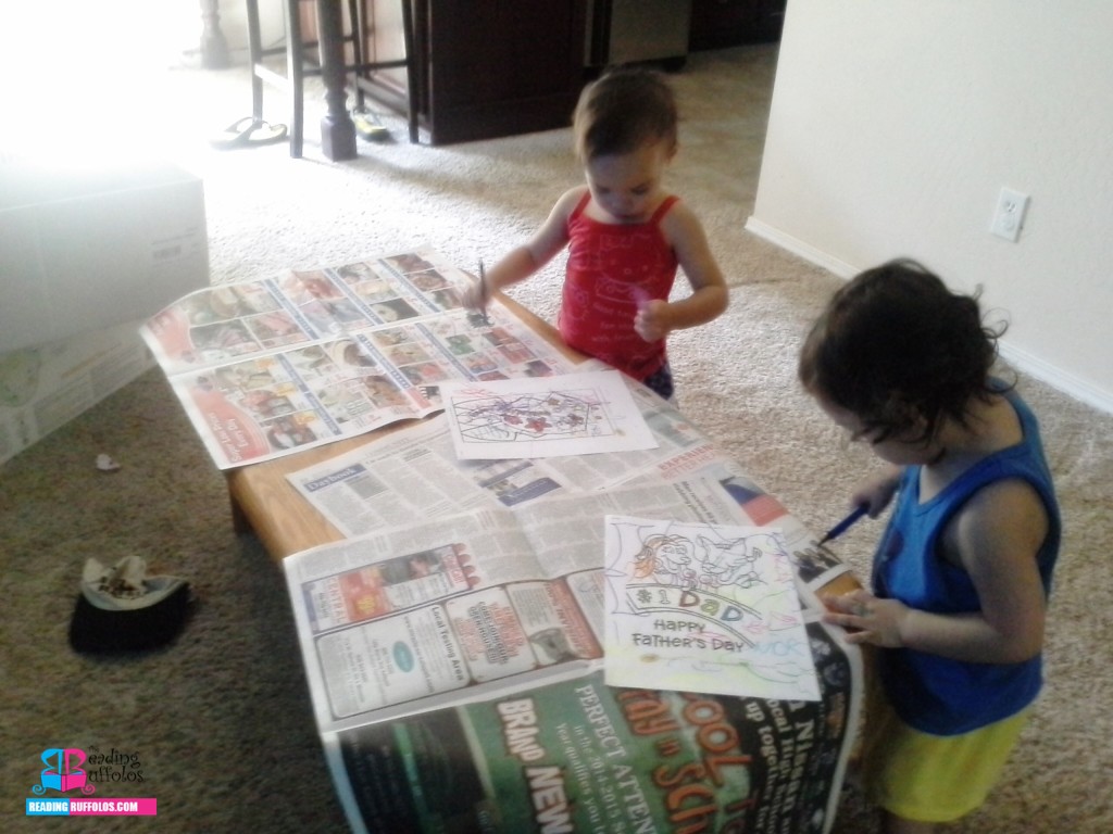 Newspaper covering the table to prevent major colored pen mess.